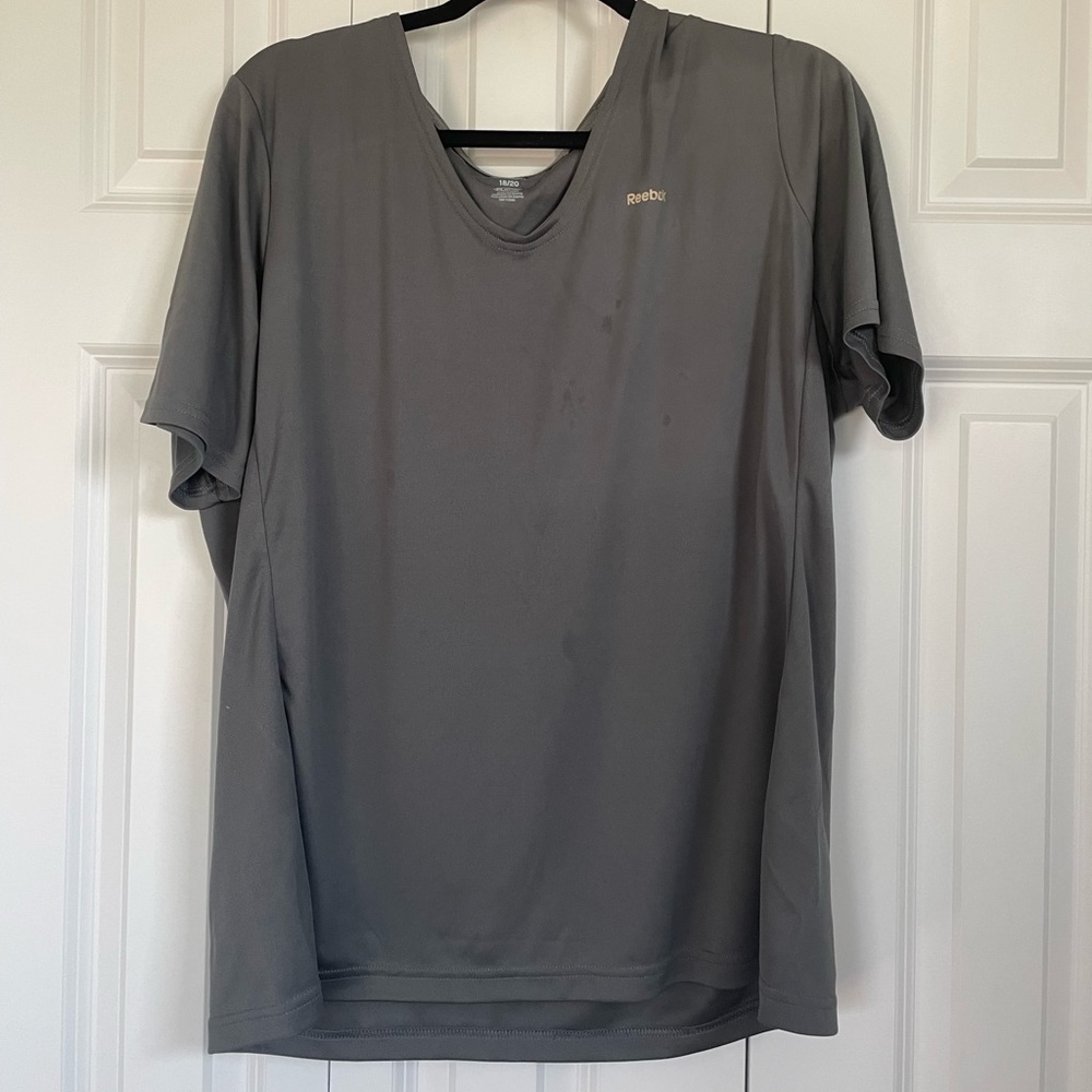 Woman’s grey Reebok tee